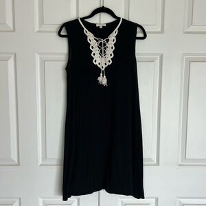 Max Studio black dress with white lace trim.